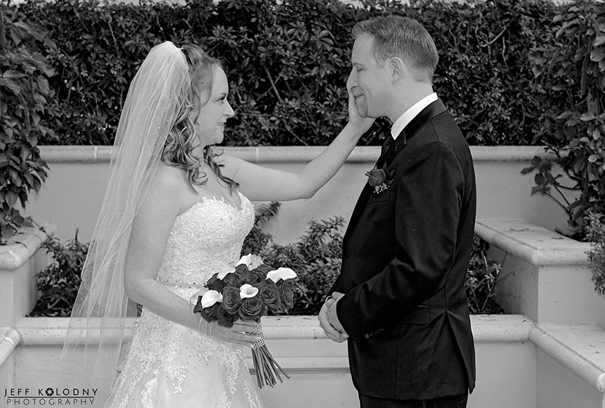Bride with her hand on the grooms face, taken just after the first look.