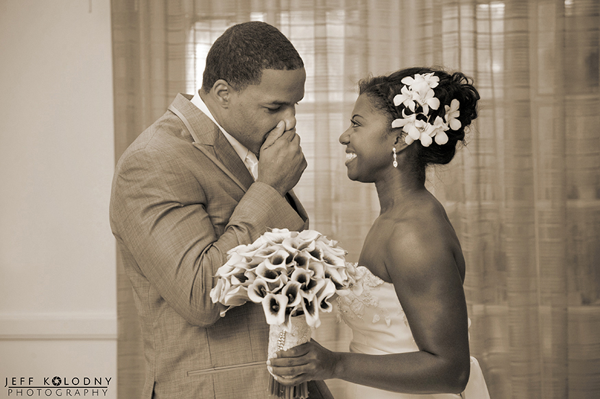 Groom using his hands to express emotions during the first look.