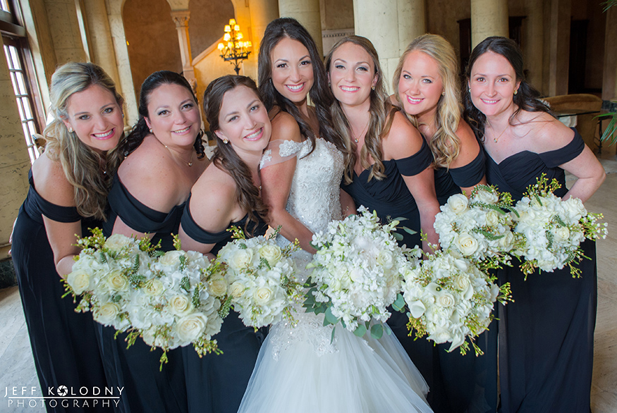 Bride and her bridesmaids group picture taken in the lobby of the Biltmore Hotel.